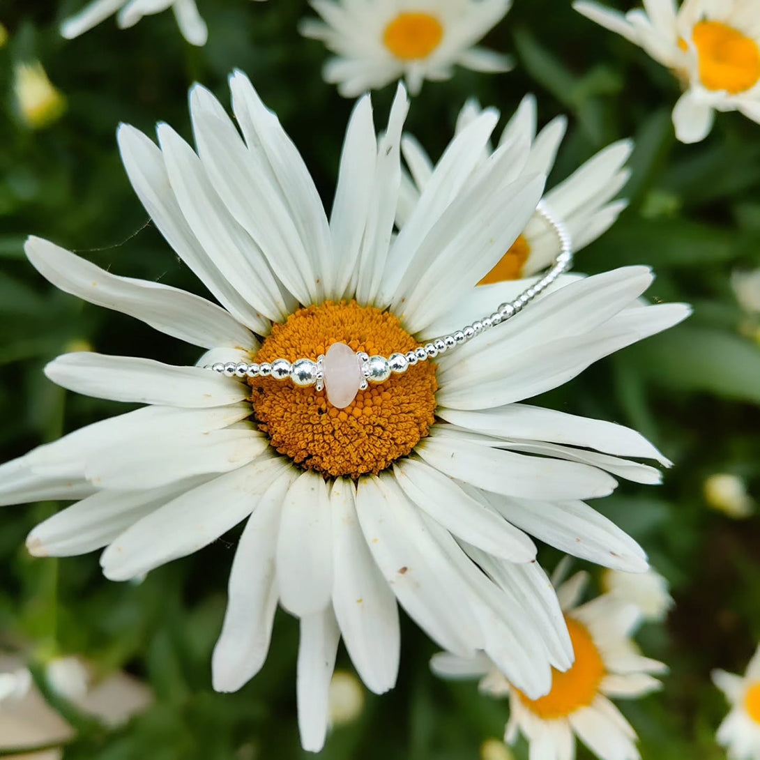 A Sterling Silver ring on a flower
