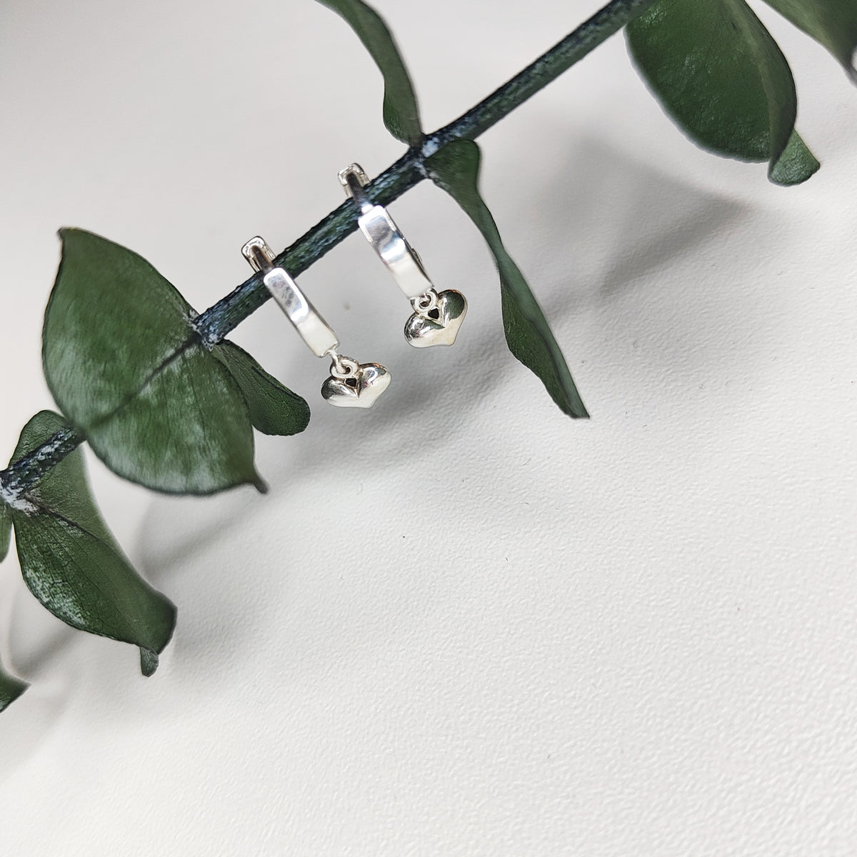 Handcrafted Small Heart Huggie Earrings earrings by Lae Jewellery