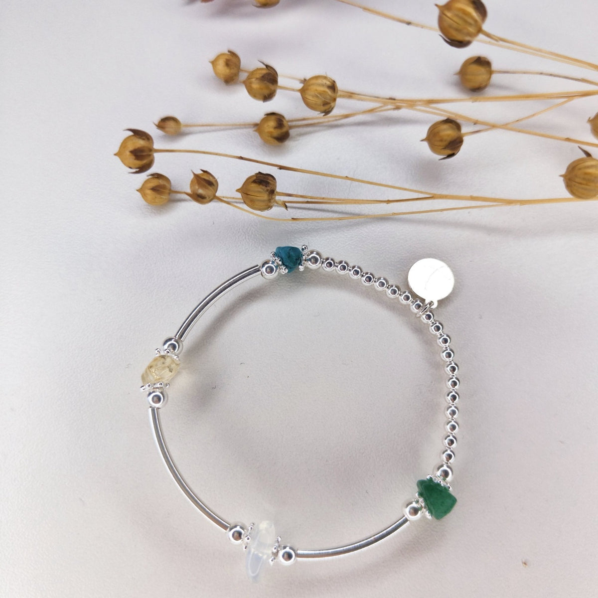 An example Create Your Own bracelet with several gemstones