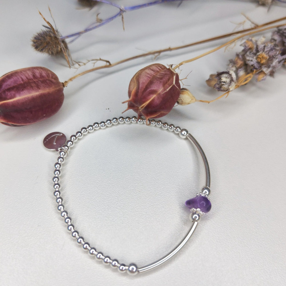 An example Create Your Own bracelet with several gemstones