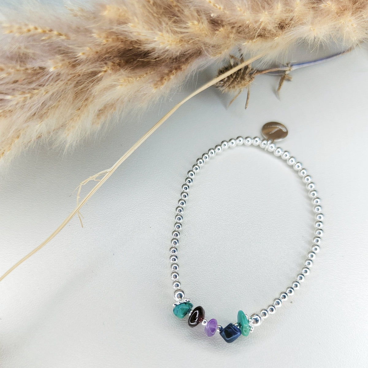 An example Create Your Own bracelet with several gemstones